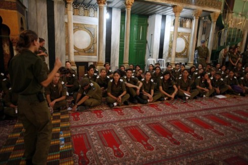 Israeli soldiers receive a lesson inside